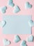 Green pastel card hearts on pink textured background