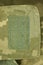 green patch velcro on spotted military clothing