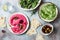 Green pea and pink beet hummus spread or dip with mix salad leaves. Healthy raw summer appetizer, vegan, vegetarian snack.