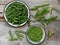 Green pea pods and cleaned in a metal bowl