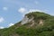 Green peak Cut against the blue sky