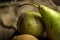 Green pears, fresh fruits on wooden background