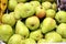 Green pears pile at the market