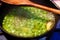 Green peas cooking in pan