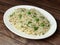 Green Peas Pulao cooked with masala spices, served over a rustic wooden background, selective focus