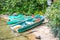 Green pedalo, boat and canoe in National park