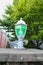 A green pedestal lantern