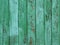 Green peeled wooden background