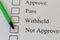 Green pen pointing Not Approve text in checkbox.