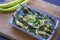 Green pepper salad on wooden cutting board - baked green peppers
