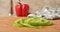 Green pepper slices appearing on a countertop