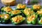 Green peppers stuffed with pumpkin. Selective focus. Macro.