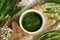 Green pesto sauce made of fresh bear\\\'s garlic leaves - wild edible plant harvested in early spring