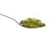 Green pesto in a spoon