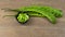 Green Petai bean fruit or Sato vegetable peeled on wooden table