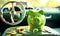 Green piggy bank in the car with different coins. The concept of purchasing, credit, leasing or car insurance