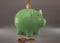 Green piggy bank with cryptocurrencies, golden physical coins, Ripple, Zcoin, Bitcoin and Etherium. Mining cryptocurrency