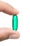 Green pill in hand