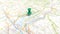 A green pin stuck in Lake Garda on a map of Italy