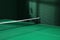 Green ping pong table with net in room
