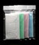 Green, pink, light blue and white ear loop disposable face mask in plastic bag overlapping, used for covering mouth and nose