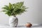 Green plant vase pot with marble background texture