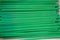 Green plastic drinking straw