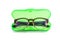 Green Plastic eyeglasses case isolated on white