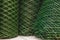 Green plastic mesh in rolls for the garden, used for protection and fencing