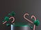 Green podium with Christmas decoration on black background. Xmas composition. Elegant scene for product, cosmetic