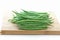 Green Pole Beans on Bamboo Chopping Board