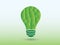 A green polygon idea bulb light on light background for creativity