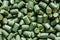 Green polymer dye in granules, background texture