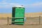 Green portable toilet outdoors