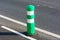 Green post installed on protected bikeway, bike lane or route