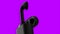 Green and purple background. Motion. A bright background of the same color on which a black case with airpods and