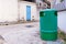 Green recycling bin container or garbage Trashcan on the street