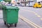 Green recycling bin container or garbage Trashcan on the street