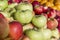 Green and red apples on the counter in the market. Vitamins and healthy foods. Close-up