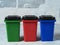 green, red, blue dumpsters. Garbage sorting concept