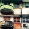 Green and red at facade building, antique flat with old architecture