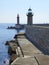 Green and red lighthouses at port entrance