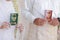 the green and red marriage book held by the bride and groom after marriage