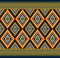Green Red Symmetry Geometric Ethnic Seamless Pattern on Blue Background