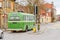 Green retro bus on British road in England