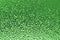 Green ribbed glass surface. Abstract background.