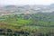 Green rice fields, palms and river Tungabhadra in the village of Hampi. Palm trees, the sun, rice fields. Tropical exotic