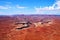 Green River canyon cutting into flat desert landscape in Canyonlands, Utah