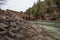 Green river and cobblestone bridge view.