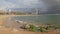 Green rocks on the Barceloneta Beach